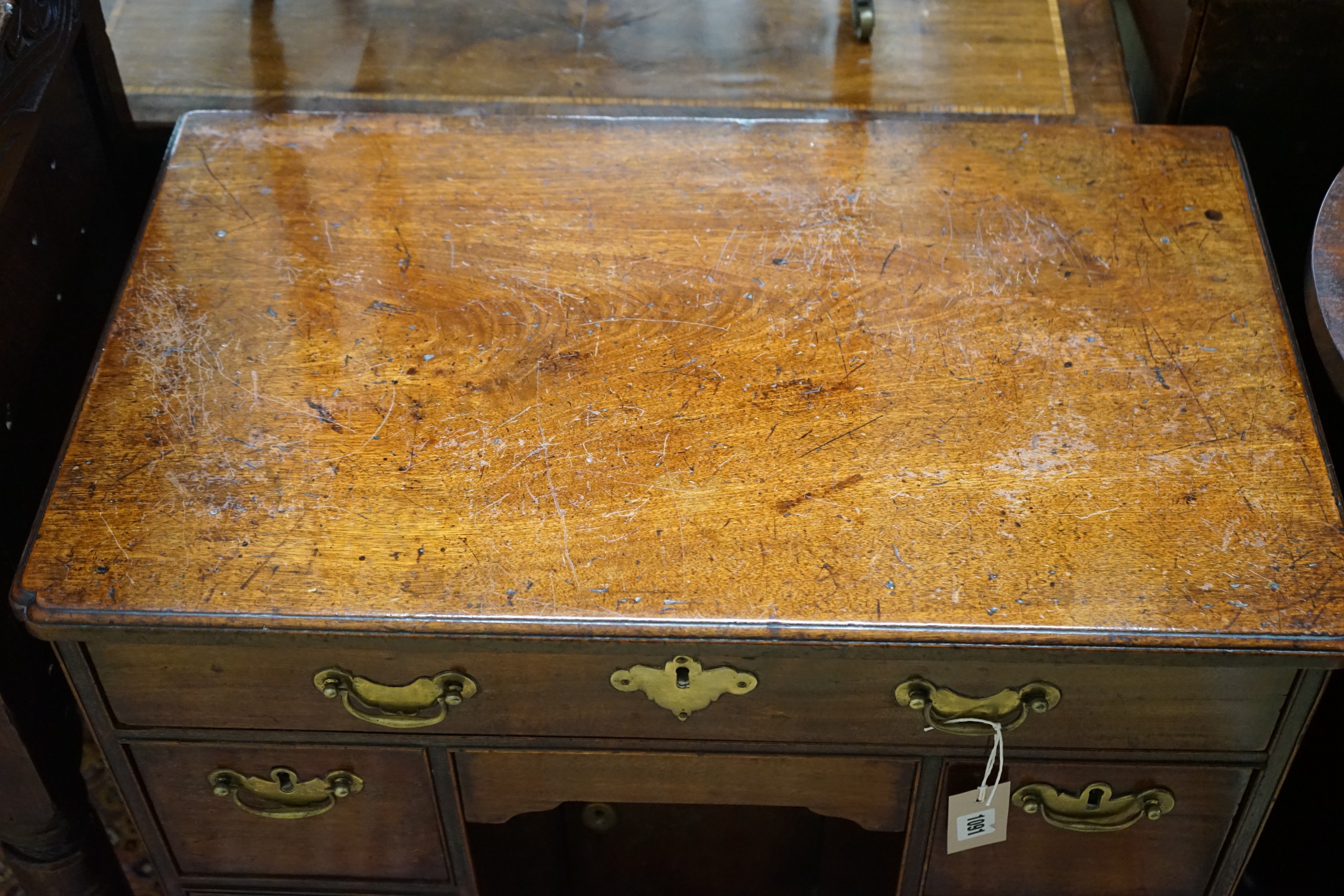 A small 18th century and later mahogany kneehole desk, width 68cm, depth 41cm, height 74cm